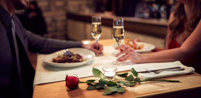 a couple in a restaurant for a romantic dinner - romantic weekend in brittany