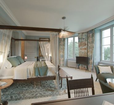 2023 08 30 - Chateau room - View D evening Room with double canopy bed, curtains and blue bedding at the relais et château de locguenole in bretagne